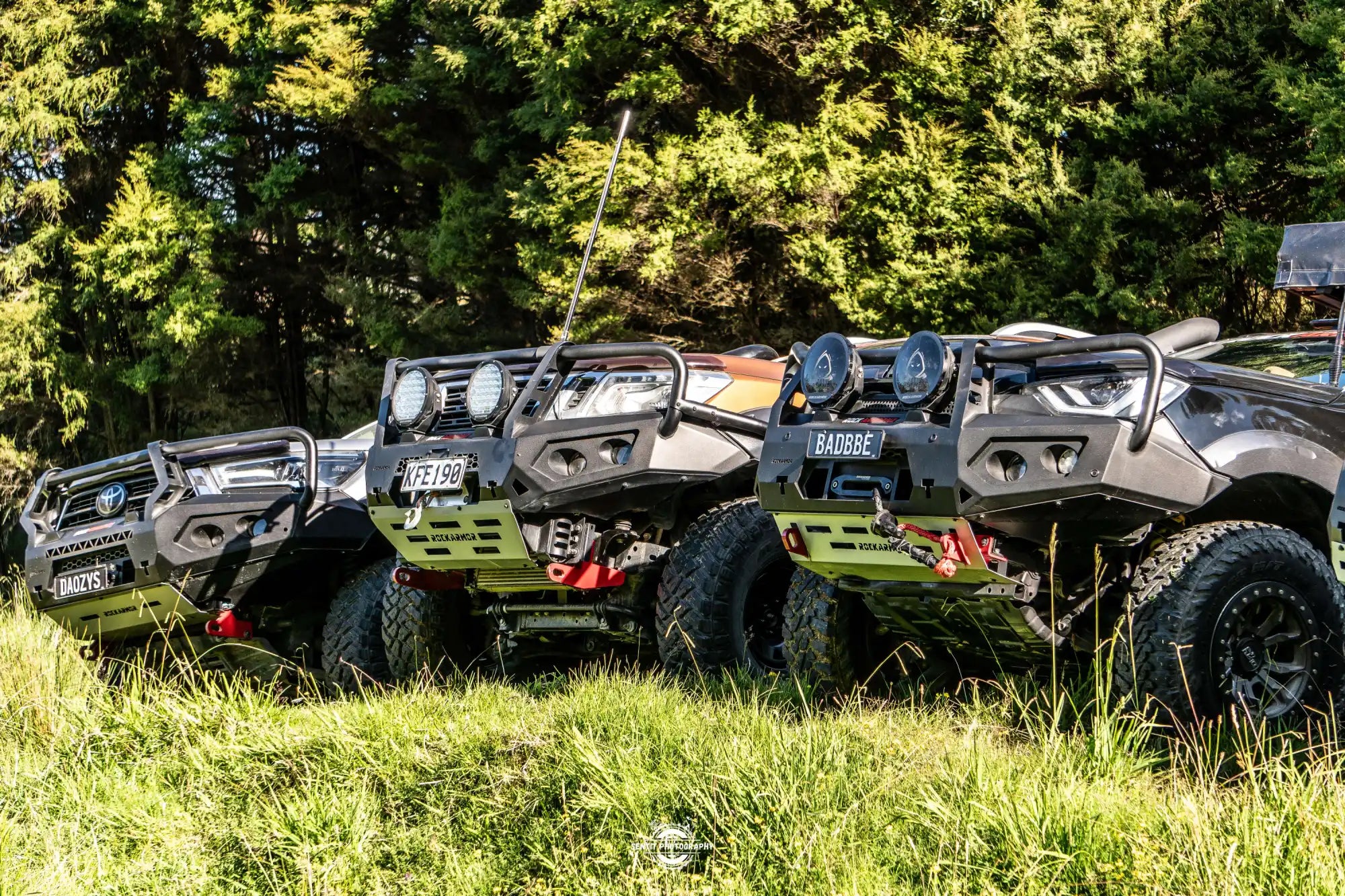 Four modified off-road trucks.