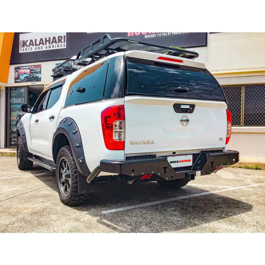 White Nissan Navara pickup truck with Rockamor Elite Steel Rear Step Towbar for NP300 D23