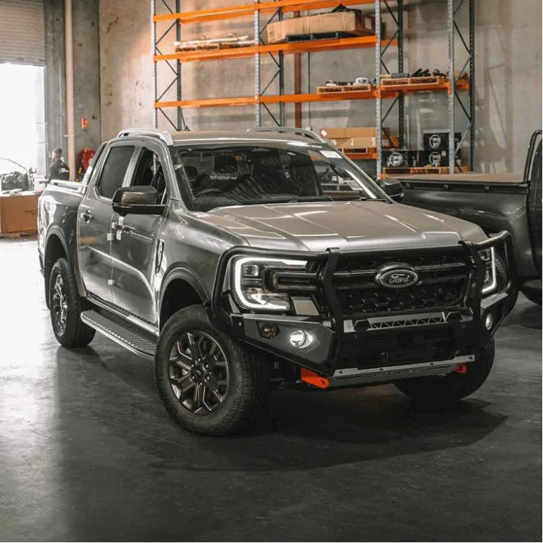Gray Ford Ranger pickup truck with Rockarmor GT Bull and driving lights installed