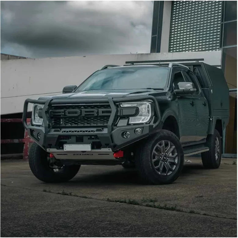 Modified black Ford pickup truck with Rockarmor GT bull bar and driving lights