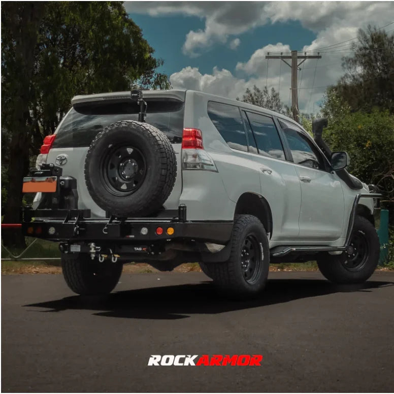 White SUV with rear spare wheel carrier on Gen III Dual Wheel Carrier for Toyota Landcruiser