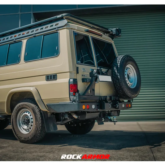 Tan off-road vehicle with Rockarmor Steel Dual Wheel Carrier for Toyota Landcruiser Fj75 Fj76 Fj78 spare wheel