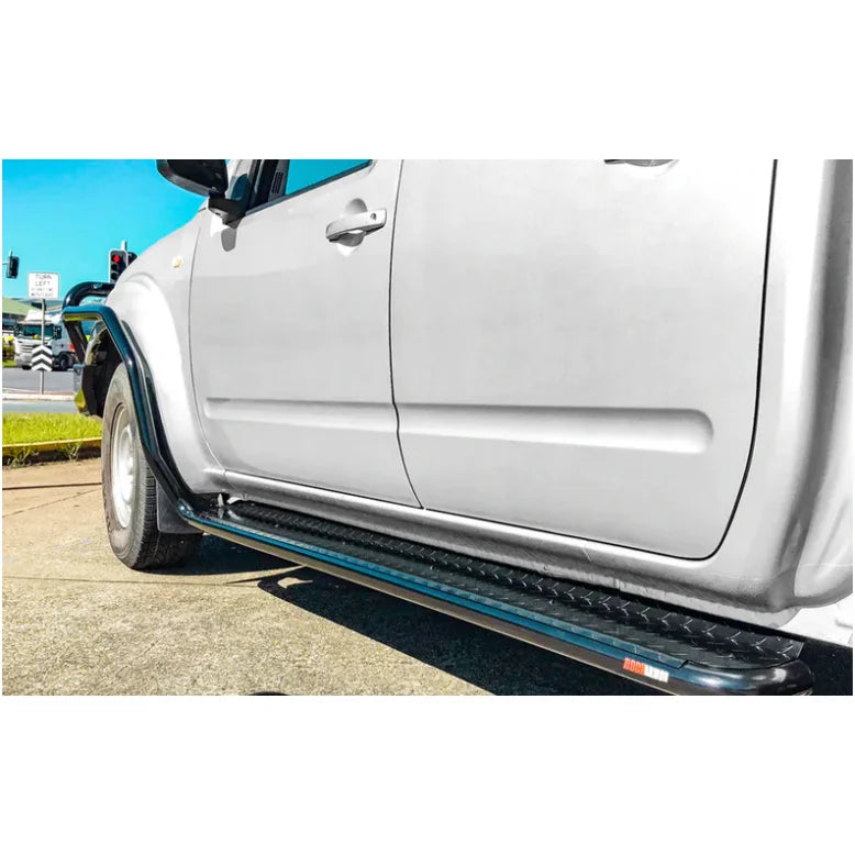 Silver pickup truck with black steel checker plate side steps for Nissan Navara D40
