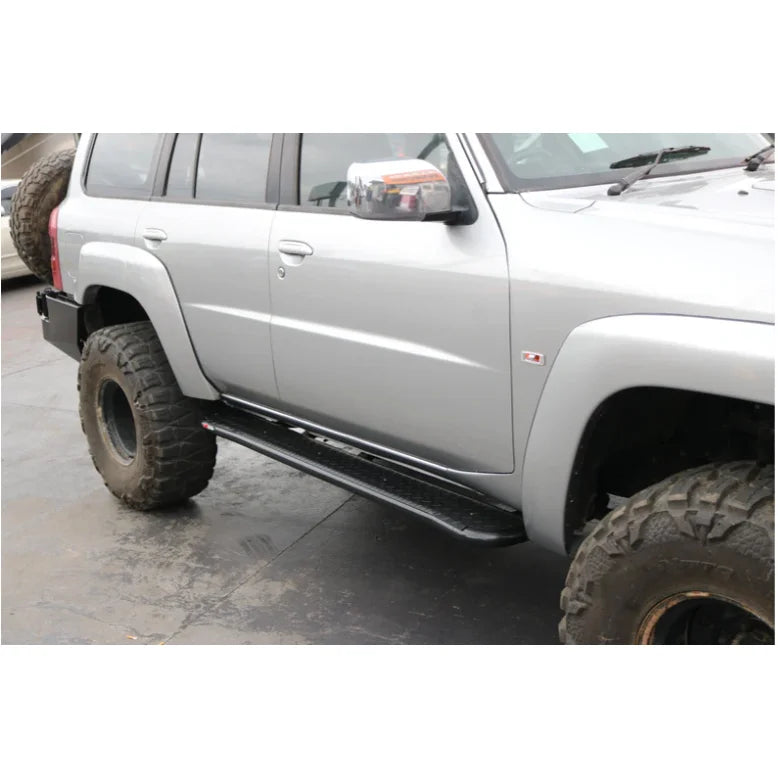Silver rockarmor steel rockslider side steps in steel suit nissan patrol y62 2010-2013 v8 shown from back side