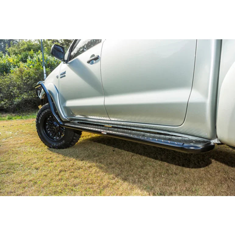 Silver pickup truck with steel checker plate side steps from Rockarmor Steel Rockslider fitting video