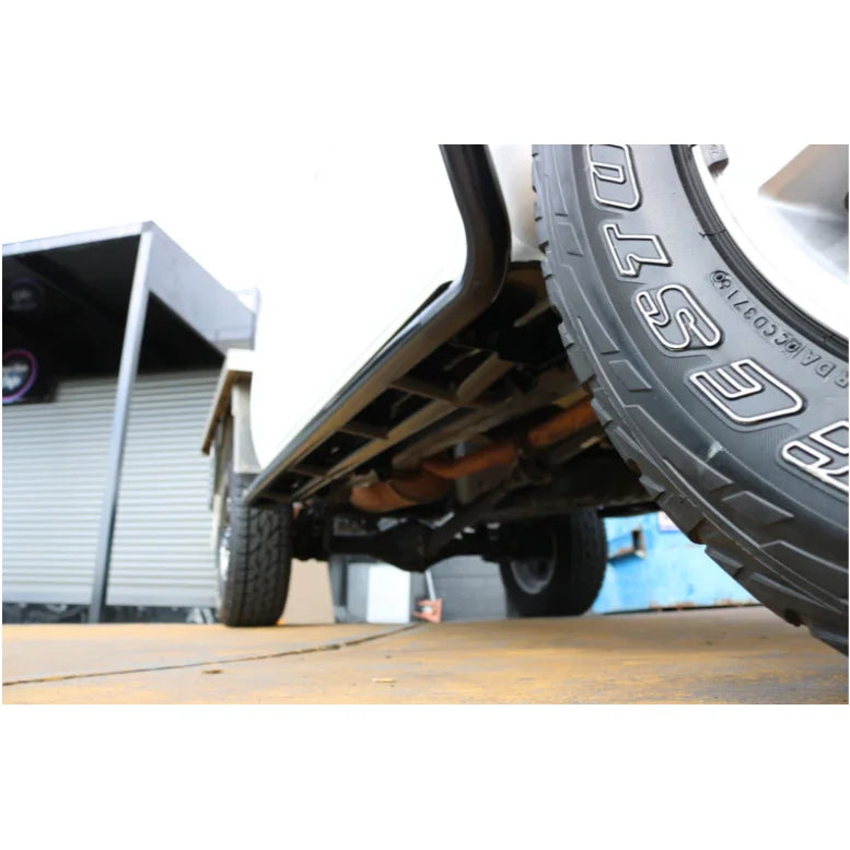 Vehicle undercarriage with steel checker plate, showing Rockarmor Steel Rockslider fitting video
