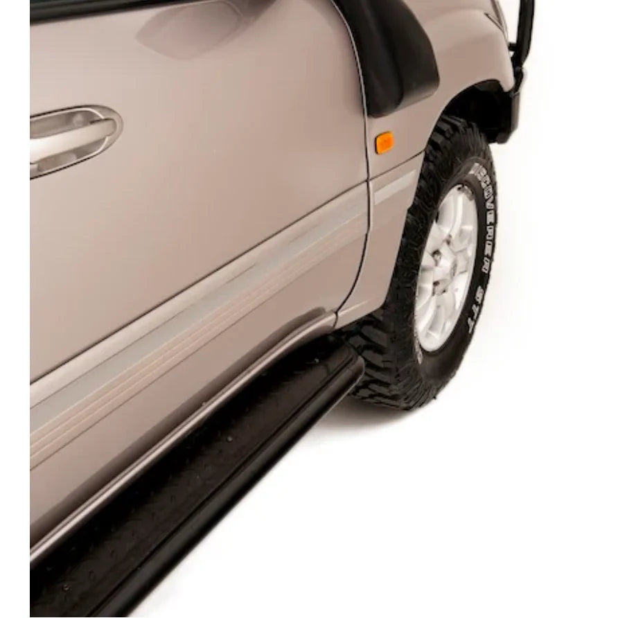Silver SUV side view with Rockarmor Steel Rockslider side steps on Toyota Landcruiser FJ100