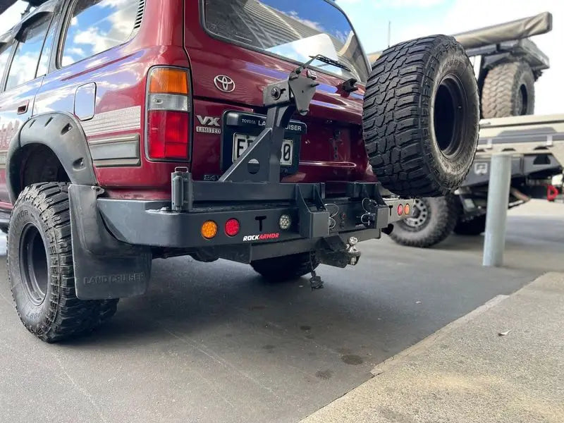 Maroon SUV with Rear Tire Carrier in Wheel Carriers Collection