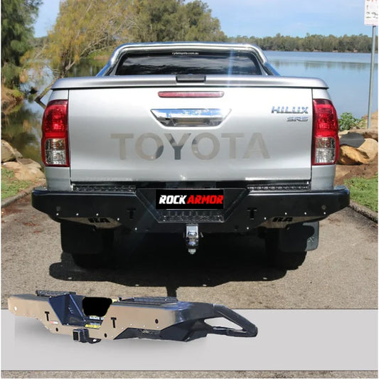 Silver Toyota Hilux N80 with black bumper featuring Rockamor Elite Steel rear step and towbar rear installation