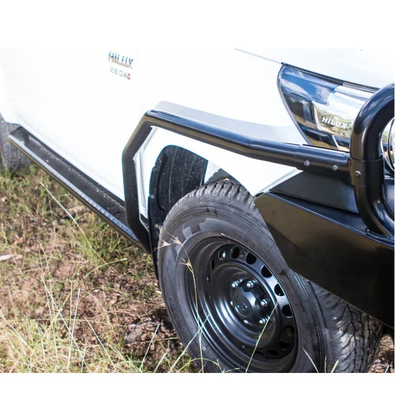White toyota hilux n80 pickup with black steel rockarmor brushbar for enhanced protection 2015-2020 model