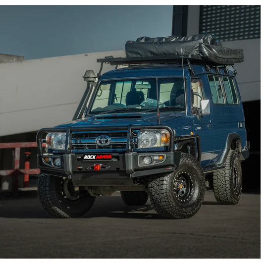 Blue toyota troopy carrier with rockarmor brushbar and roof tent suited for off-road use and gt bullbar compatibility