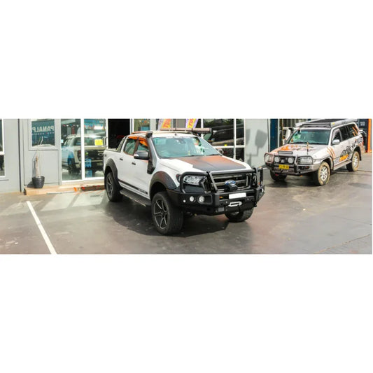 White ford ranger px1-2 pickup truck fitted with rockarmor elite steel hoop bull bar with bumper cut design