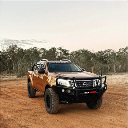 Orange nissan navara np300 pickup with black rockarmor elite steel hoop bull bar full bar replacement front view