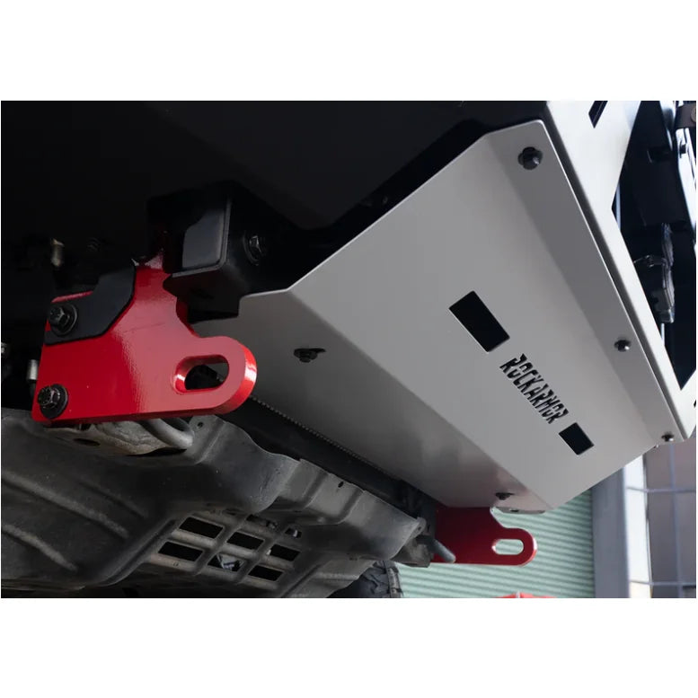 White metal undercarriage shield with red tow hooks on Rockarmor GT Hoop steel bullbar for Toyota Hilux N80