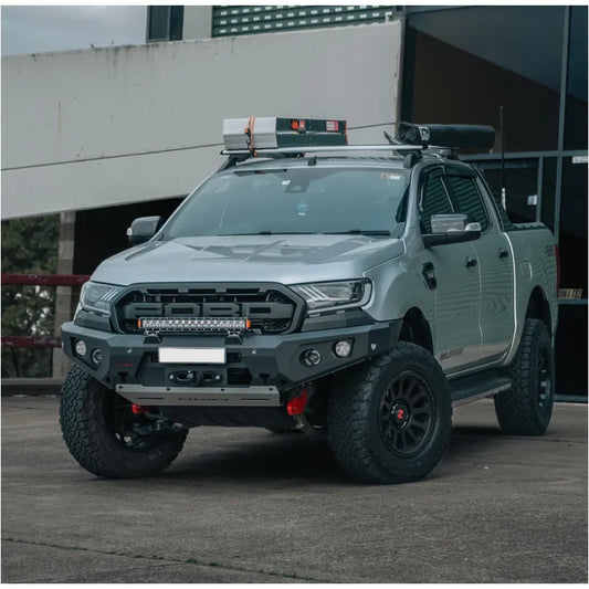 Modified silver ford ranger equipped with rockarmor gt steel hoopless bullbar featuring rated recovery points