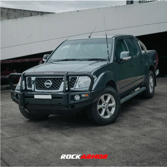 Dark green nissan navara d40 with rockarmor premium steel bullbar suitable for pathfinder r51 models front view