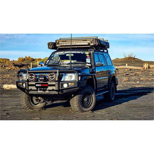 Black nissan patrol gu4 with rockarmor premium steel bullbar and roof rack featuring led fog lights
