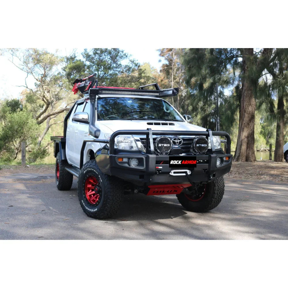 White off-road pickup truck equipped with rockarmor premium steel bullbar for toyota hilux 2011-15 winch compatible with fog lights
