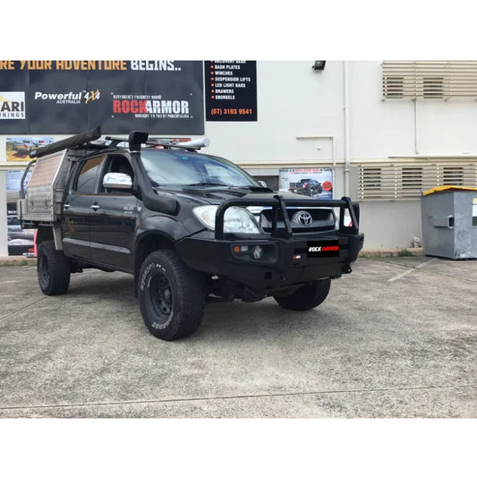 Black Toyota Hilux N70 with rockarmor premium steel bull bar featuring a bumper cut for off-road protection