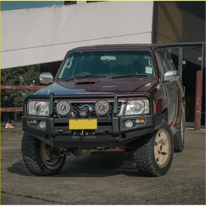 Maroon Nissan Patrol with black rockarmor premium bullbar and rugged off-road tires for GU4 2005 to current models