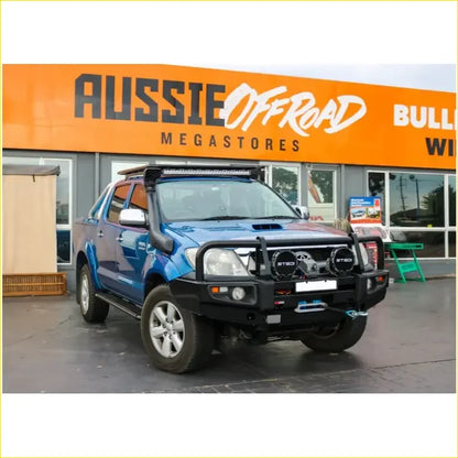 Blue toyota hilux n70 2005 2011 with black rockarmor premium bullbar roof light and off-road bumper