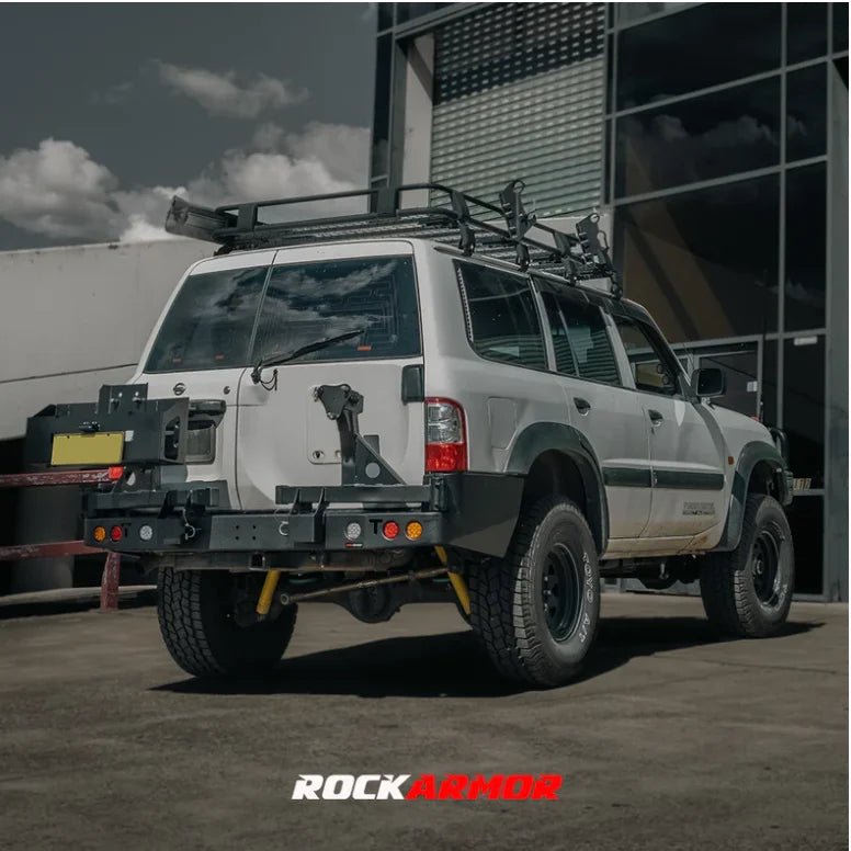 White off-road vehicle with rockarmor steel dual spare wheel carrier roof rack for nissan patrol y61 model