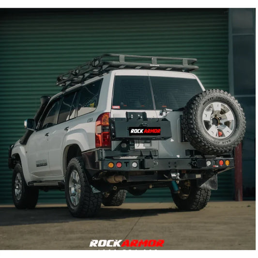 White SUV with Rockarmor Steel Dual Wheel Carrier for Nissan Patrol Y61 spare wheel