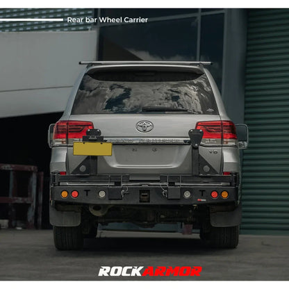Rear view of a silver toyota landcruiser fj200 with rockarmor steel dual wheel carrier on built in towbar