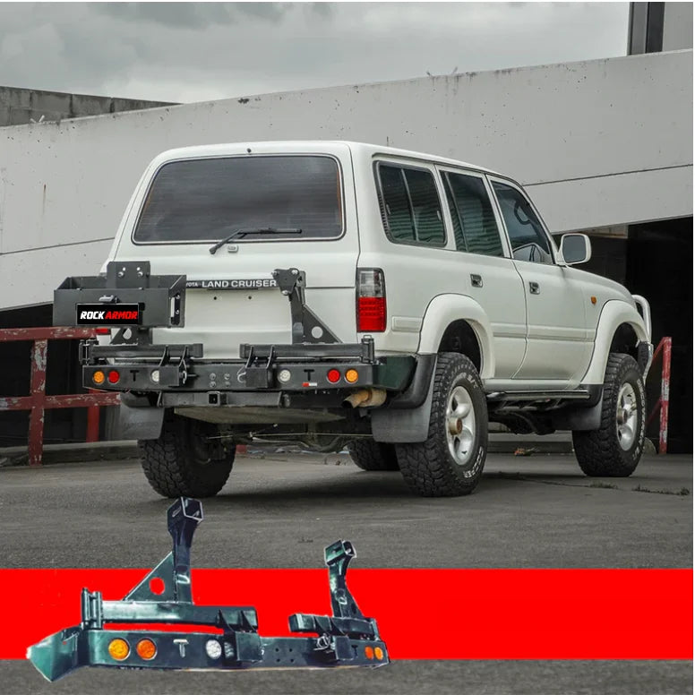 White toyota landcruiser fj80 rear view with rockarmor steel dual wheel carrier mounting kit and aftermarket bumper