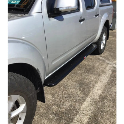 Silver pickup truck with black running board and steel checker plate side steps