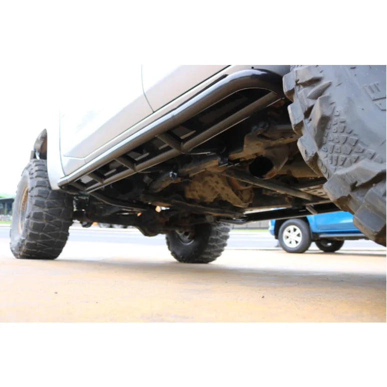 Truck undercarriage showing black rockarmor steel rockslider with oversized tires suit Nissan Patrol Y62 2010-2013 V8