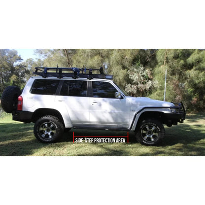 White off-road vehicle with roof rack featuring rockarmor steel rockslider side steps to suit nissan patrol y62 v8