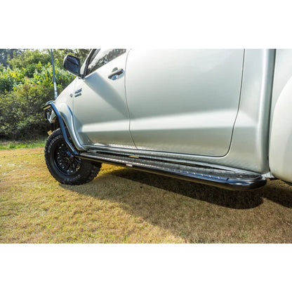 Silver toyota hilux n70 fitted with rockarmor steel rockslider checker plate step side steps 2005-2015 model