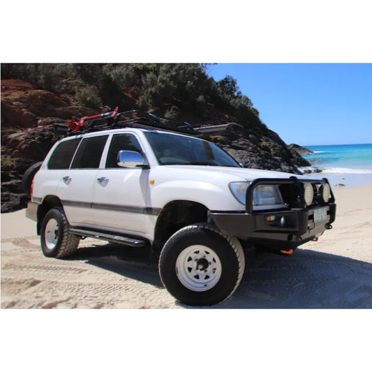 White off-road vehicle with roof rack featuring rockarmor steel rockslider side steps to suit toyota landcruiser wagon solid live axle