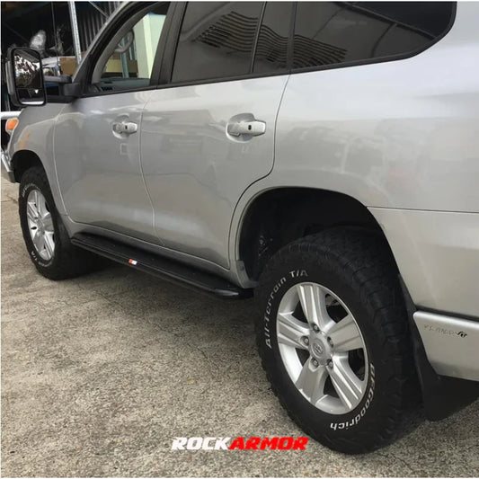 Silver SUV with steel checker plate side steps from Rockarmor Steel Rockslider fitting video
