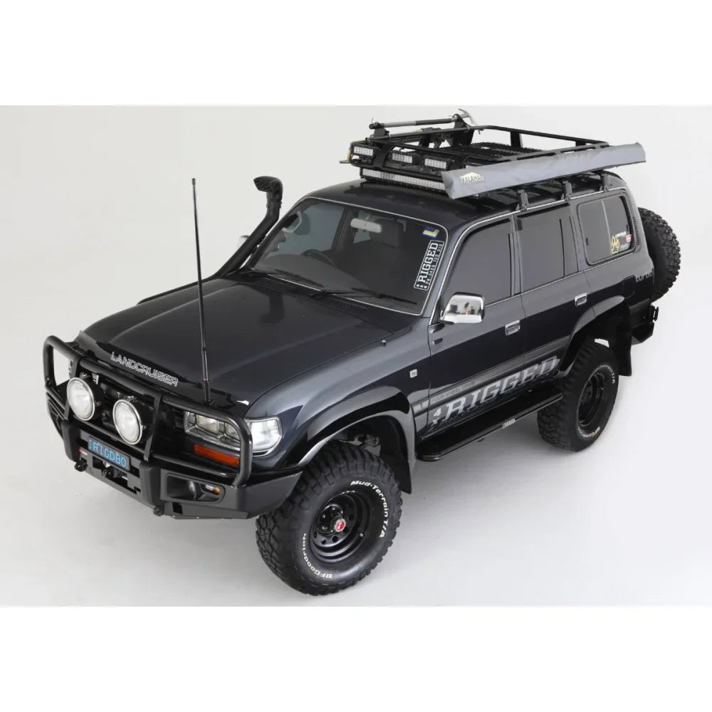 Black toyota landcruiser fj80 with rockarmor steel rockslider checker plate step and roof rack visible from the side