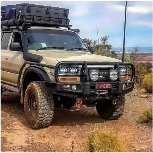 Modified tan off-road vehicle with steel checker plate rockslider side steps for Toyota Landcruiser Fj80